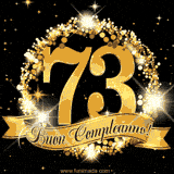 Il numero 73 è circondato da un anello dorato brillante, accompagnato da un nastro elegante con la scritta 'Buon Compleanno!' su uno sfondo scuro.