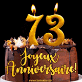 GIF animé pour un 73e anniversaire avec une élégante gâteau au chocolat, des bougies dorées formant le chiffre 73 et le texte 'Joyeux Anniversaire!' en écriture dorée.