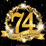 Il numero 74 è circondato da un anello dorato brillante, accompagnato da un nastro elegante con la scritta 'Buon Compleanno!' su uno sfondo scuro.
