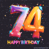 A vibrant age-specific birthday short animation displays the number '74' in shiny balloon-like letters with the words 'Happy Birthday' underneath. The dark background is punctuated with festive stars and balloons.