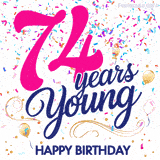 Colorful animated birthday GIF displaying the text '74 years Young' in bright pink and navy blue, with confetti falling and gold balloons floating.