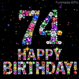 On a dark space, the number 74 and Happy Birthday phrase are built using colorful glittering jewels, accompanied by tiny animated twinkling bright shining stars.