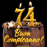 GIF animato con una torta al cioccolato decorata con crema, dettagli dorati e due candele accese che formano il numero 74. Messaggio 'Buon Compleanno' in scritta elegante.