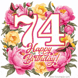 A celebratory GIF image features the animated number '74' and the words 'Happy Birthday!' surrounded by pink and yellow flowers. Two moving butterflies are included in this festive design.