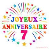 GIF animé joyeux anniversaire 7 ans avec étoiles multicolores et feu d’artifice
