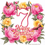 A celebratory GIF image features the animated number '7' and the words 'Happy Birthday!' surrounded by pink and yellow flowers. Two moving butterflies are included in this festive design.