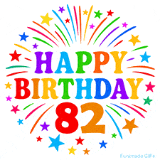 Festive 'Happy Birthday 82' animated GIF with rainbow-colored letters surrounded by fireworks and stars