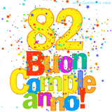 Animazione con il numero 82 in giallo e scritte multicolore 'Buon Compleanno!', accompagnate da una pioggia di stelle e coriandoli colorati.