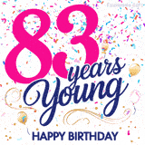 Colorful animated birthday GIF displaying the text '83 years Young' in bright pink and navy blue, with confetti falling and gold balloons floating.