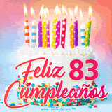 GIF animado con un pastel blanco decorado con confites y velas de colores encendidas, acompañado de la frase 'Feliz 83 cumpleaños' sobre un fondo alegre.
