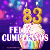 GIF animado de un cupcake decorado con confites, dos velas doradas encendidas formando el número 83, sobre un fondo púrpura brillante con destellos.