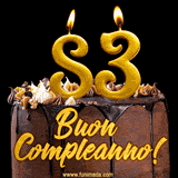 GIF animato con una torta al cioccolato decorata con crema, dettagli dorati e due candele accese che formano il numero 83. Messaggio 'Buon Compleanno' in scritta elegante.