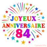 GIF animé joyeux anniversaire 84 ans avec étoiles multicolores et feu d’artifice