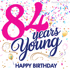 Colorful animated birthday GIF displaying the text '84 years Young' in bright pink and navy blue, with confetti falling and gold balloons floating.