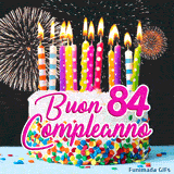 Buon compleanno 84 anni in questa GIF festosa con torta bianca, zuccherini e esplosioni di luce pirotecnica animate.