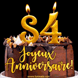 GIF animé pour un 84e anniversaire avec une élégante gâteau au chocolat, des bougies dorées formant le chiffre 84 et le texte 'Joyeux Anniversaire!' en écriture dorée.