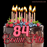 GIF animé pour un 84e anniversaire avec un somptueux gâteau au chocolat décoré de baies fraîches, des bougies allumées et le texte '84 Bonne Fête!' en rouge.