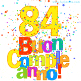 Animazione con il numero 84 in giallo e scritte multicolore 'Buon Compleanno!', accompagnate da una pioggia di stelle e coriandoli colorati.