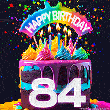Chocolate cake with cyan layers, pink dressing and a big number 84 adorned with vibrant multicolored frosting, lit candles, and a rainbow topper with text that says 'Happy Birthday'. Animated colorful confetti move behind the cake.