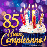 GIF 85° compleanno rappresentante il numero 85 d'oro brillante accanto a un cupcake illuminato su scenario lila.