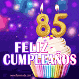 GIF animado de un cupcake decorado con confites, dos velas doradas encendidas formando el número 85, sobre un fondo púrpura brillante con destellos.