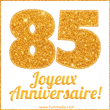 GIF animé joyeux anniversaire pour 85 ans avec un chiffre 85 brillant en or et le texte 'Joyeux Anniversaire!' en écriture élégante sur un fond blanc.