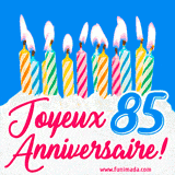 GIF animé joyeux anniversaire pour 85 ans avec des bougies colorées allumées, un fond bleu vif et le texte 'Joyeux Anniversaire 85!' en écriture élégante.