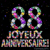 Image animée affichant le chiffre 88 et Joyeux Anniversaire en cristaux multicolores scintillants, entourés de petites lumières sur fond sombre.