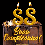 GIF animato con una torta al cioccolato decorata con crema, dettagli dorati e due candele accese che formano il numero 88. Messaggio 'Buon Compleanno' in scritta elegante.