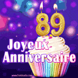 GIF animé joyeux anniversaire pour 89 ans avec un cupcake coloré, des bougies dorées en forme de 89 et un fond violet scintillant.