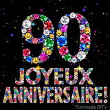 Le chiffre 90 et l'inscription Joyeux Anniversaire dessinés par des joyaux brillants multicolores, entourés de petites étincelles sur fond sombre.