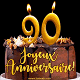 GIF animé pour un 90e anniversaire avec une élégante gâteau au chocolat, des bougies dorées formant le chiffre 90 et le texte 'Joyeux Anniversaire!' en écriture dorée.