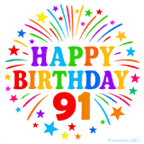 Festive 'Happy Birthday 91' animated GIF with rainbow-colored letters surrounded by fireworks and stars