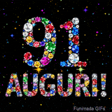 Animazione con il numero 91 e la parola Auguri creati da pietre preziose colorate, con un effetto scintillante su sfondo nero.