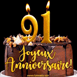 GIF animé pour un 91e anniversaire avec une élégante gâteau au chocolat, des bougies dorées formant le chiffre 91 et le texte 'Joyeux Anniversaire!' en écriture dorée.