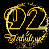 A celebratory animated graphic reads '92 & Fabulous!', rendered in sparkly gold text on a black background with starburst animations.