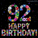 Brightly colored sparkling crystals shape the digit 92 and Happy Birthday lettering, positioned on a dark background featuring small animated glowing stars.