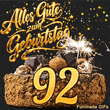 Alles Gute zum Geburtstag steht glänzend über dem Kuchen mit der 92. Ein Sternenregen in Gold und die brennende Wunderkerze erhellen das Bild.
