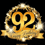 A golden 92nd birthday GIF features a decorative circle and ribbon. The design sparkles with light and gold accents against a black background.