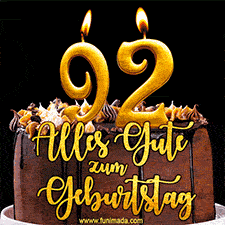 Animiertes GIF mit einer Schokoladen-Geburtstagstorte, großen goldenen Kerzen mit der Zahl 92 und einem dekorativen Text mit der Aufschrift 'Alles Gute zum Geburtstag'.