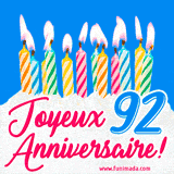 GIF animé joyeux anniversaire pour 92 ans avec des bougies colorées allumées, un fond bleu vif et le texte 'Joyeux Anniversaire 92!' en écriture élégante.