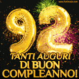 Palloncini dorati a forma del numero 92, accompagnati da scintille e fuochi d'artificio su sfondo nero, con il messaggio 'Tanti auguri di Buon Compleanno!'.