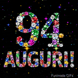 Il numero 94 e la scritta Auguri creati con gioielli brillanti di diverse tonalità su un fondo nero animato da piccole scintille di luce.