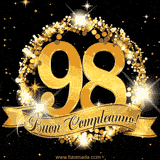 Il numero 98 è circondato da un anello dorato brillante, accompagnato da un nastro elegante con la scritta 'Buon Compleanno!' su uno sfondo scuro.