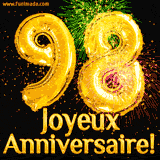 GIF animé pour un 98e anniversaire avec des ballons dorés en forme de 98, des feux d'artifice colorés et le texte 'Joyeux Anniversaire!' sur un fond noir festif.