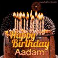 A rich chocolate cake topped with glowing birthday candles and surrounded by bright fireworks. The animated GIF displays the message 'Happy Birthday Aadam' in golden text.