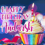 A festive animated GIF featuring a colorful cupcake with a single lit candle, sprinkles, and 'Happy Birthday Aadarsh' text against a sparkling, celebratory background.