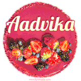 Beautifully decorated red velvet berry birthday cake with vibrant fruits and a glowing 'Aadvika' name, adding a touch of sweetness and sparkle.