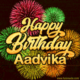 Golden text reading 'Happy Birthday Aadvika' surrounded by vibrant fireworks in red, green, and yellow, set against a dark background in this celebratory birthday GIF.