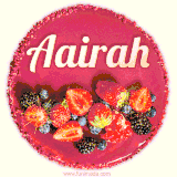 Beautifully decorated red velvet berry birthday cake with vibrant fruits and a glowing 'Aairah' name, adding a touch of sweetness and sparkle.